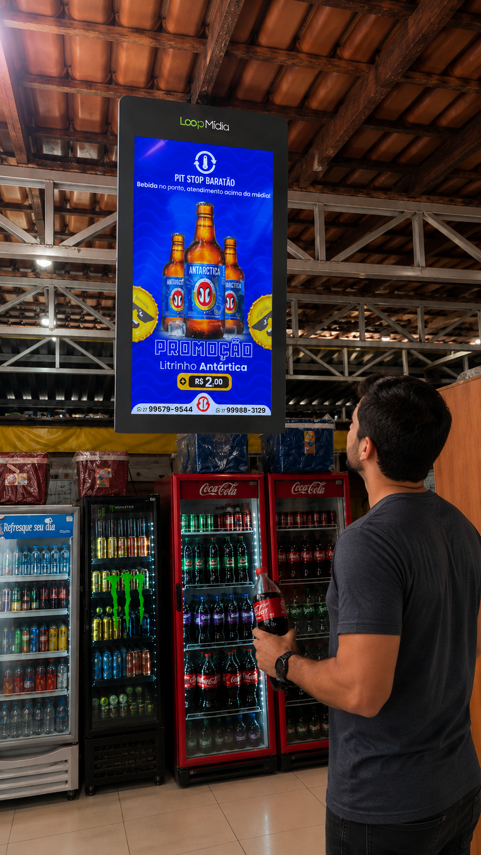 Tela da TV Corporativa Loop Mídia instalada no Pit Stop Baratão